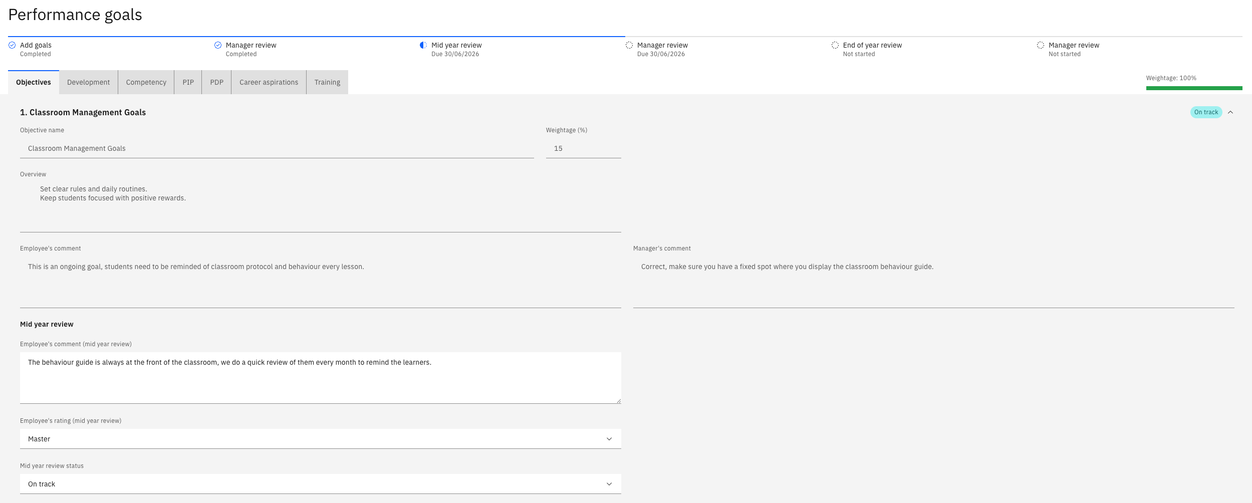 A goal at mid year showing the carried-forward comments and the new comment field