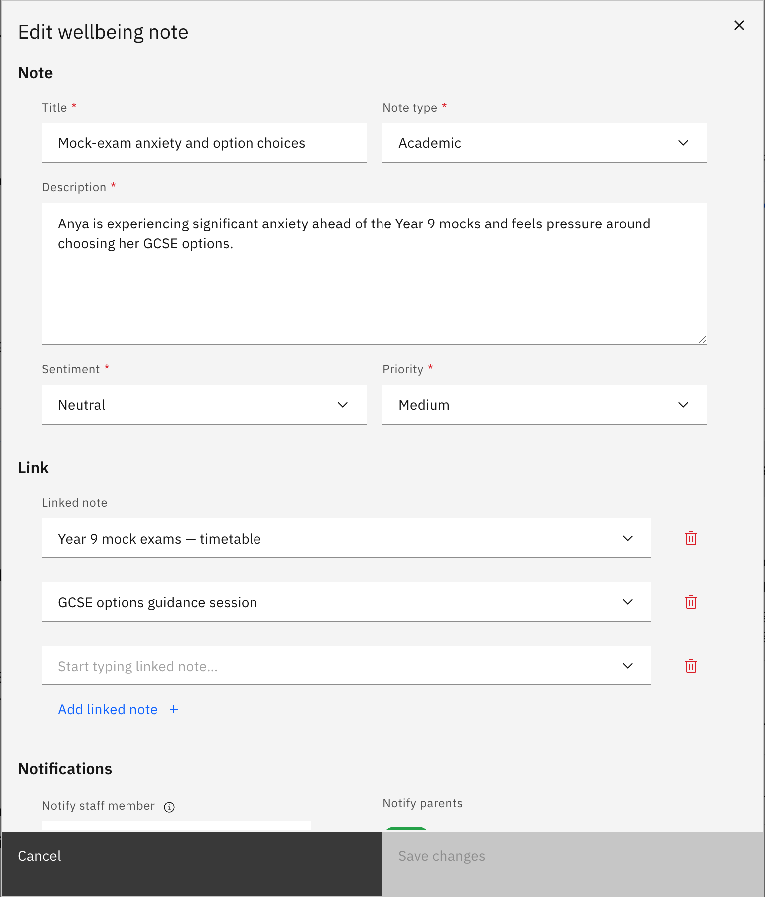 The Edit wellbeing note modal with the Title, Note type, Description, Sentiment, Priority, and linked notes pre-filled